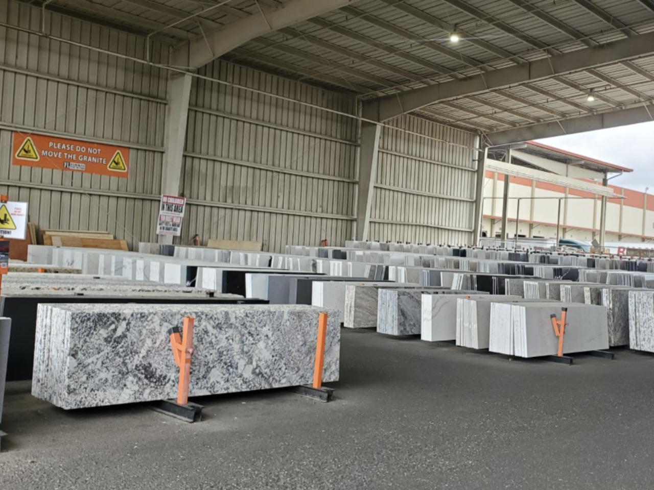 Polished Granite Floor Slabs Stacked In Warehouse Stock Photo